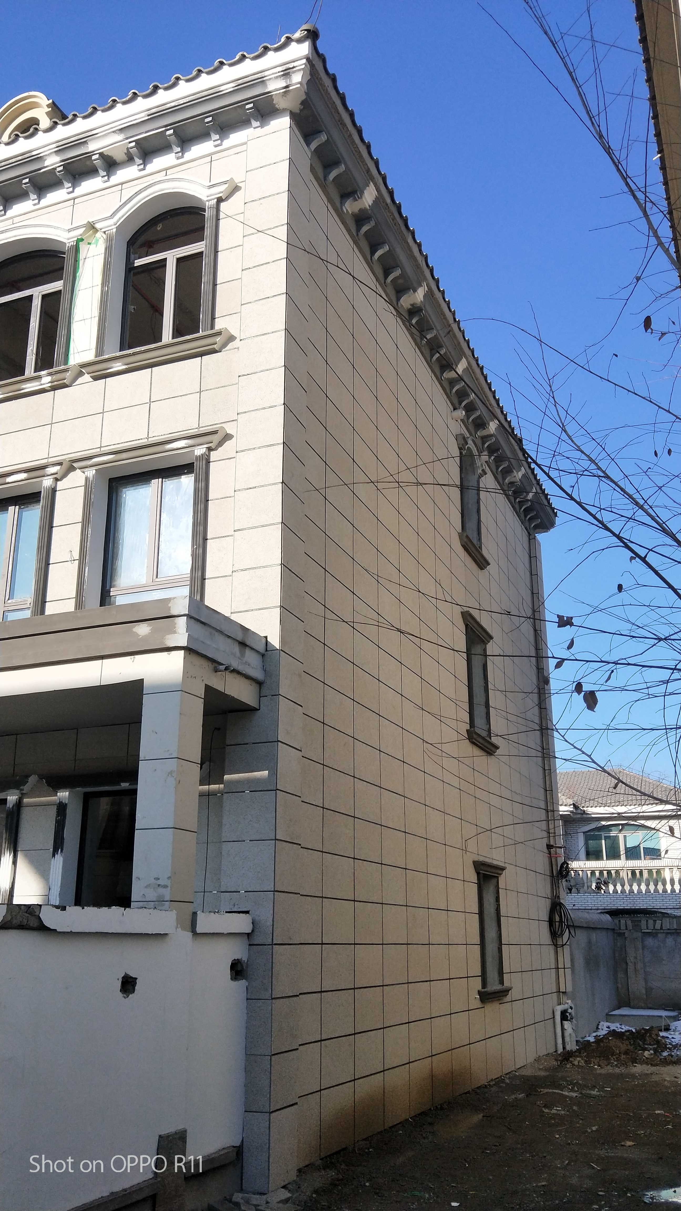 保定宏孚庄园真岩石聚苯保温装饰一体板上墙案例