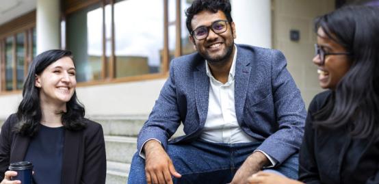 Students sitting on steps outside